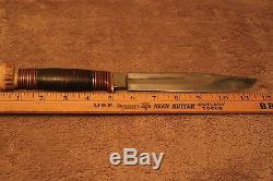 Classic Wade & Butcher Marbles style hunting knife with etched blade and sheath