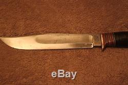 Classic Wade & Butcher Marbles style hunting knife with etched blade and sheath