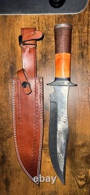 Damascus Steel Hunting Knife with Ornate Handle and Leather Sheath