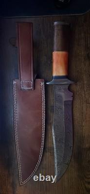 Damascus Steel Hunting Knife with Ornate Handle and Leather Sheath