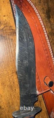Damascus Steel Hunting Knife with Ornate Handle and Leather Sheath