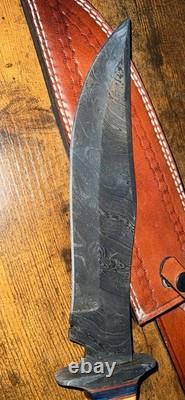 Damascus Steel Hunting Knife with Ornate Handle and Leather Sheath