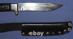 Hunting knife with leather sheath