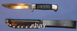 Hunting knife with leather sheath