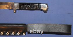 Hunting knife with leather sheath