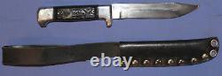 Hunting knife with leather sheath