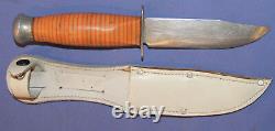 Vintage hunting knife with leather sheath