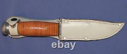 Vintage hunting knife with leather sheath