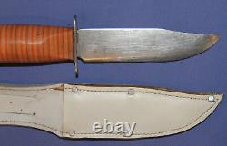 Vintage hunting knife with leather sheath