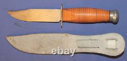 Vintage hunting knife with leather sheath