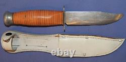 Vintage hunting knife with leather sheath